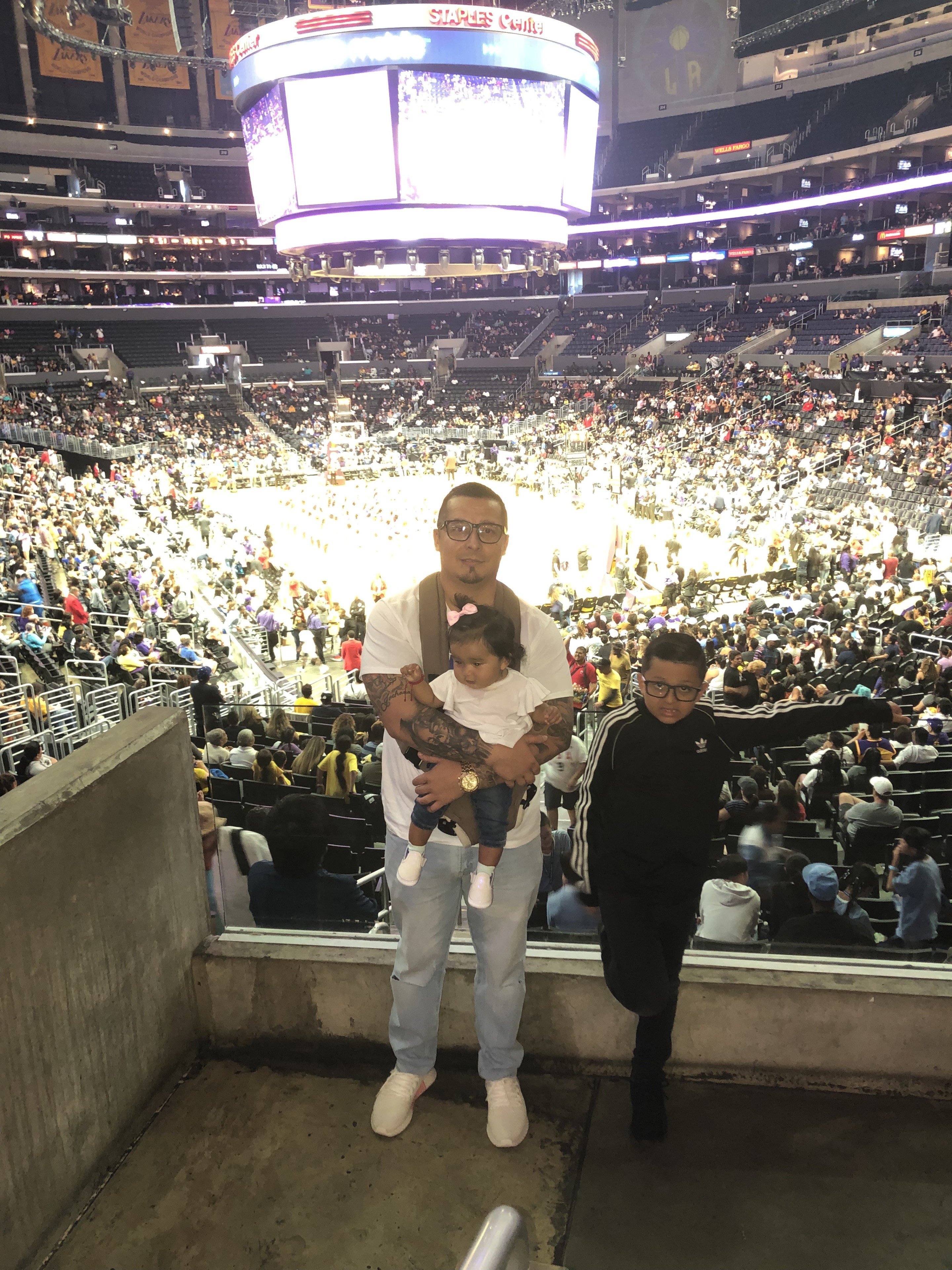 Sparky the mascot of the Los Angeles Sparks interacts with fans