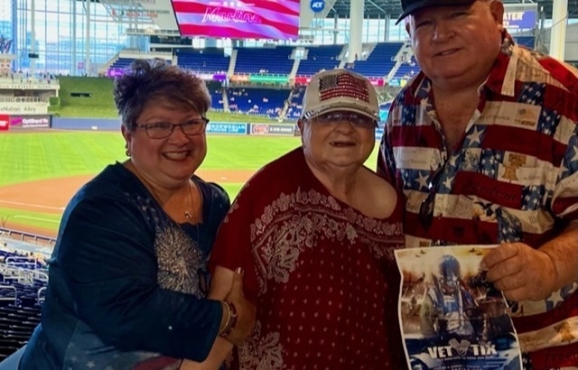 Baseball fans stand during the singing of the National Anthem before the  start of a baseball game between the Miami Marlins and the St. Louis  Cardinals, Wednesday, June 12, 2019, in Miami. (