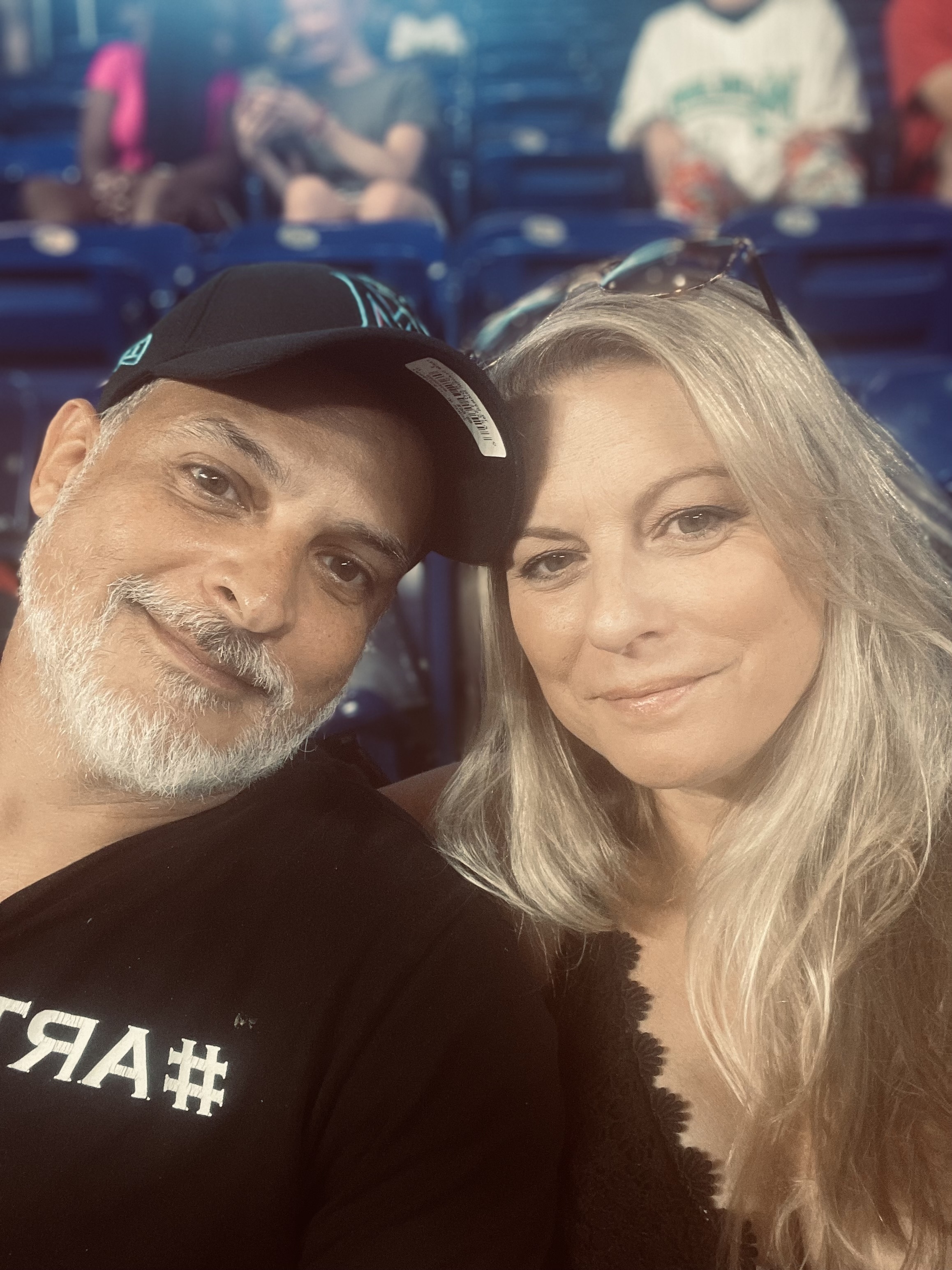 Baseball fans stand during the singing of the National Anthem before the  start of a baseball game between the Miami Marlins and the St. Louis  Cardinals, Wednesday, June 12, 2019, in Miami. (