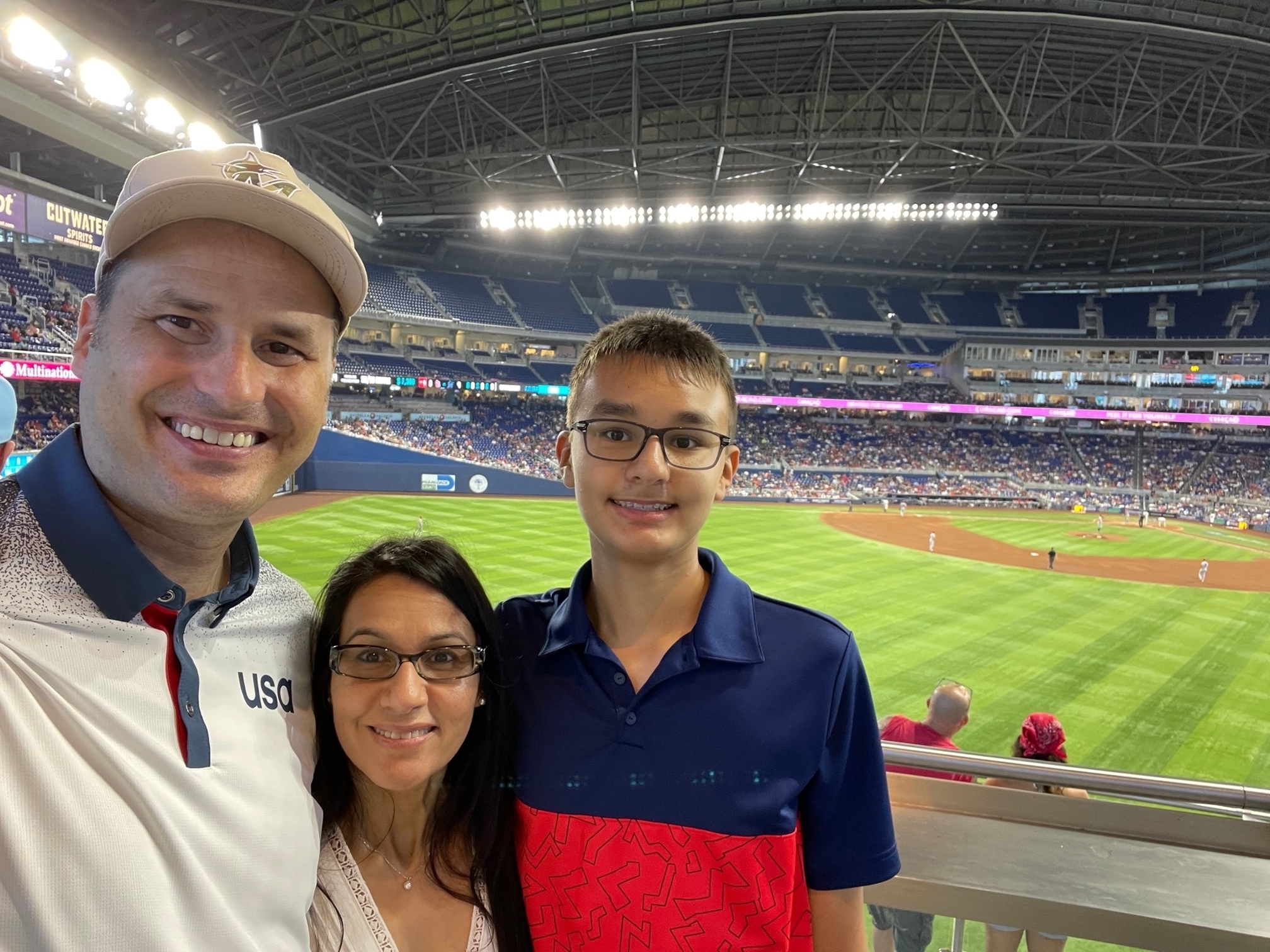 Baseball fans stand during the singing of the National Anthem before the  start of a baseball game between the Miami Marlins and the St. Louis  Cardinals, Wednesday, June 12, 2019, in Miami. (